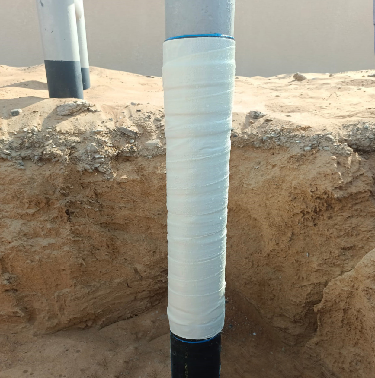 Viscotaq Viscous Elastic Wrapping
(Viscopaste, Viscowrap HT, PVC & PU
composite wrap) on Soil to Air Riser